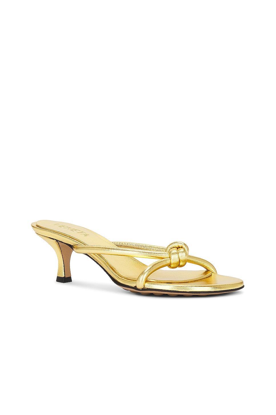 Bottega Veneta Metallic Blink Mule Sandal in Gold - Metallic Gold. Size 41 (also in 36, 36.5, 38, 38.5, 39.5, 40). Product Image