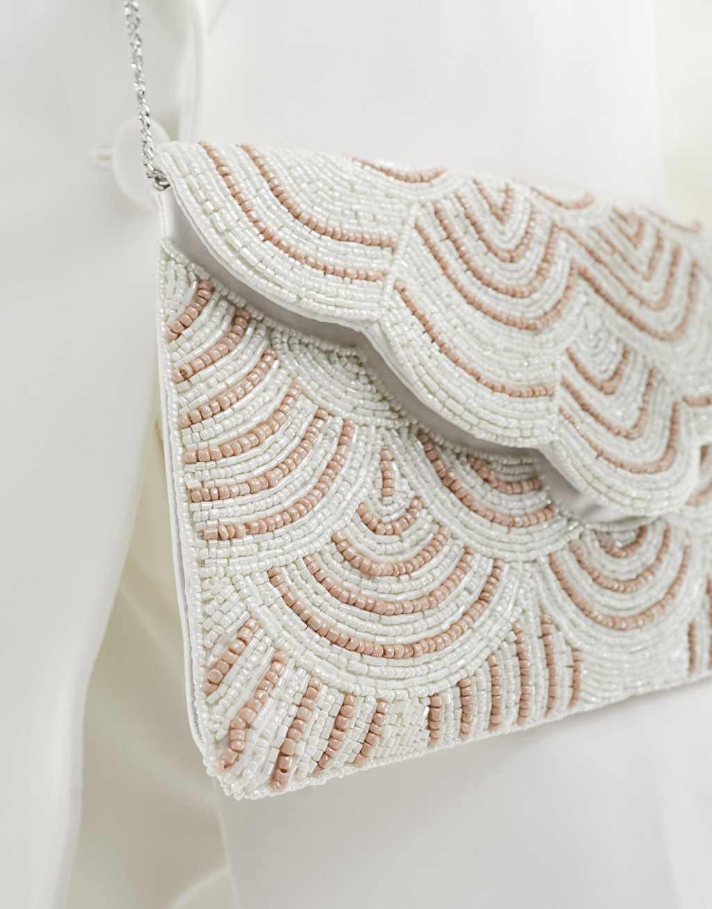 True Decadence embellished patterned envelope clutch bag in pink and cream Product Image