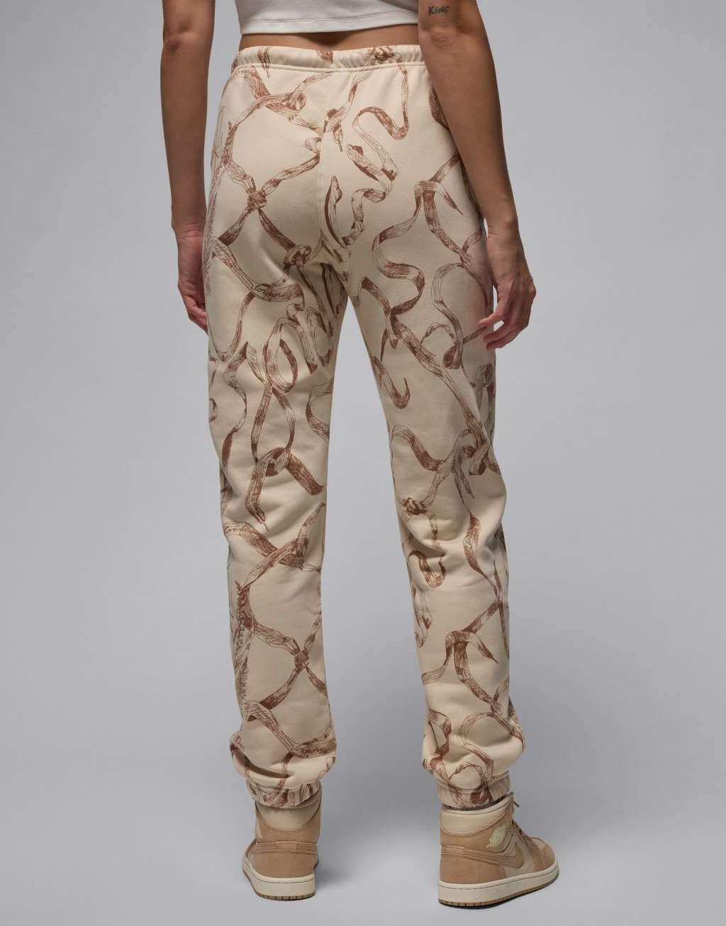 Jordan Brooklyn fleece all-over print sweatpants in brown Product Image