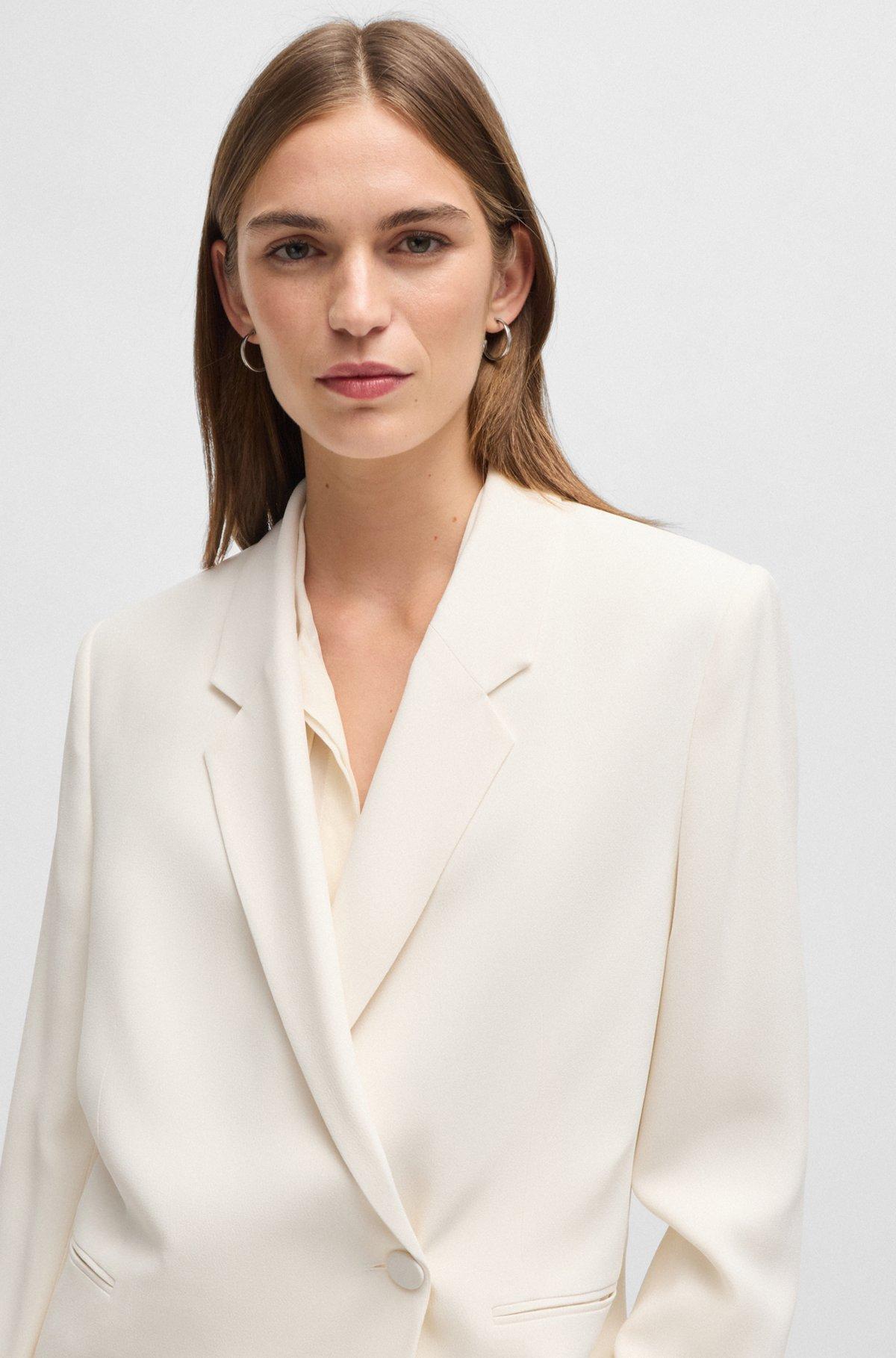 Relaxed-fit jacket with feature button Product Image