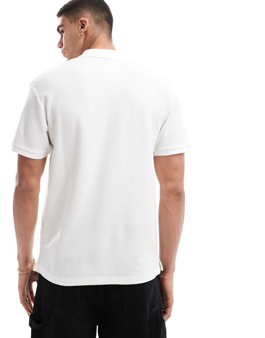 Jack & Jones waffle zip-up polo in white Product Image