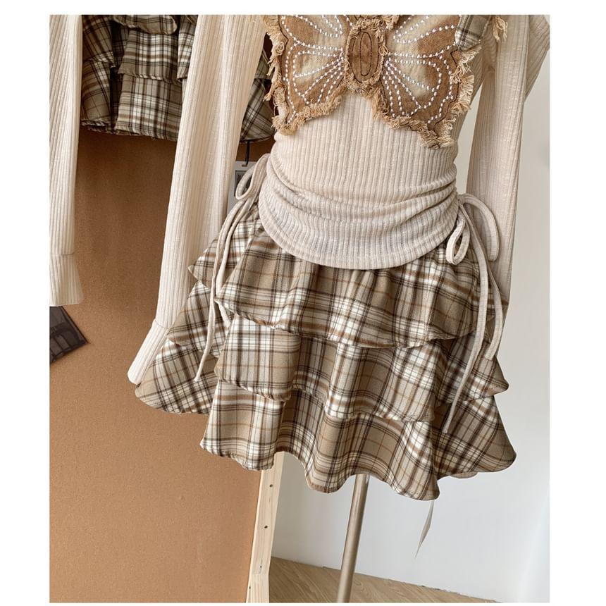 Set: Long-Sleeve Butterfly Accent Asymmetrical Top + Plaid Mini Tiered Skirt Product Image