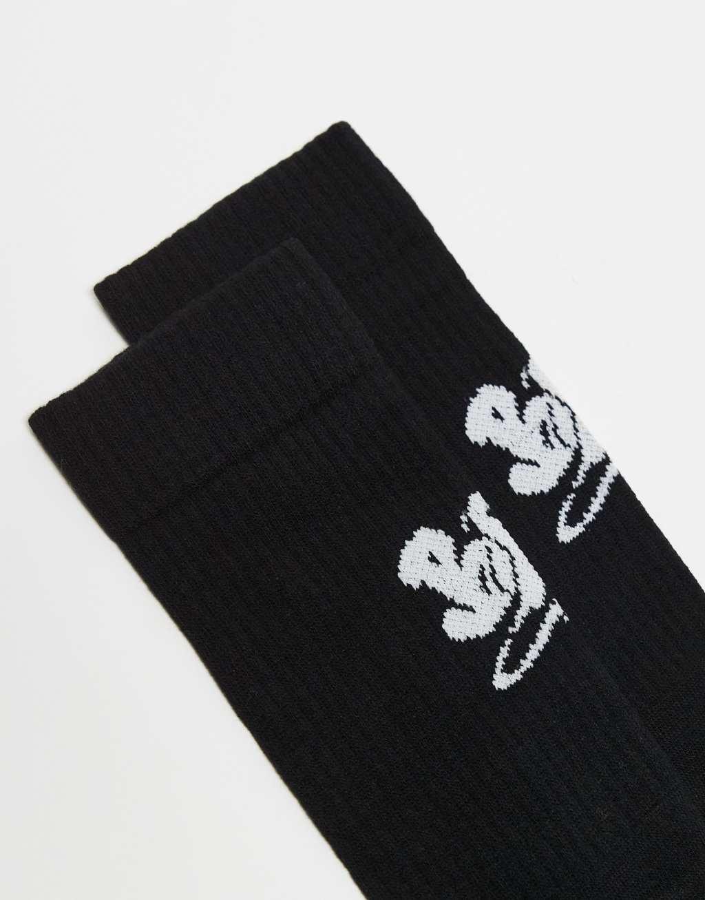 ASOS DESIGN socks with halloween BOO in black Product Image