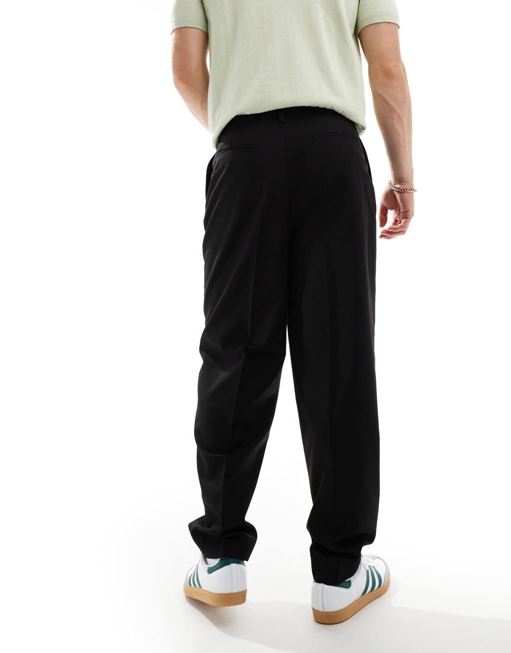 ASOS DESIGN oversized tapered fit dress pants with front pleats in black Product Image