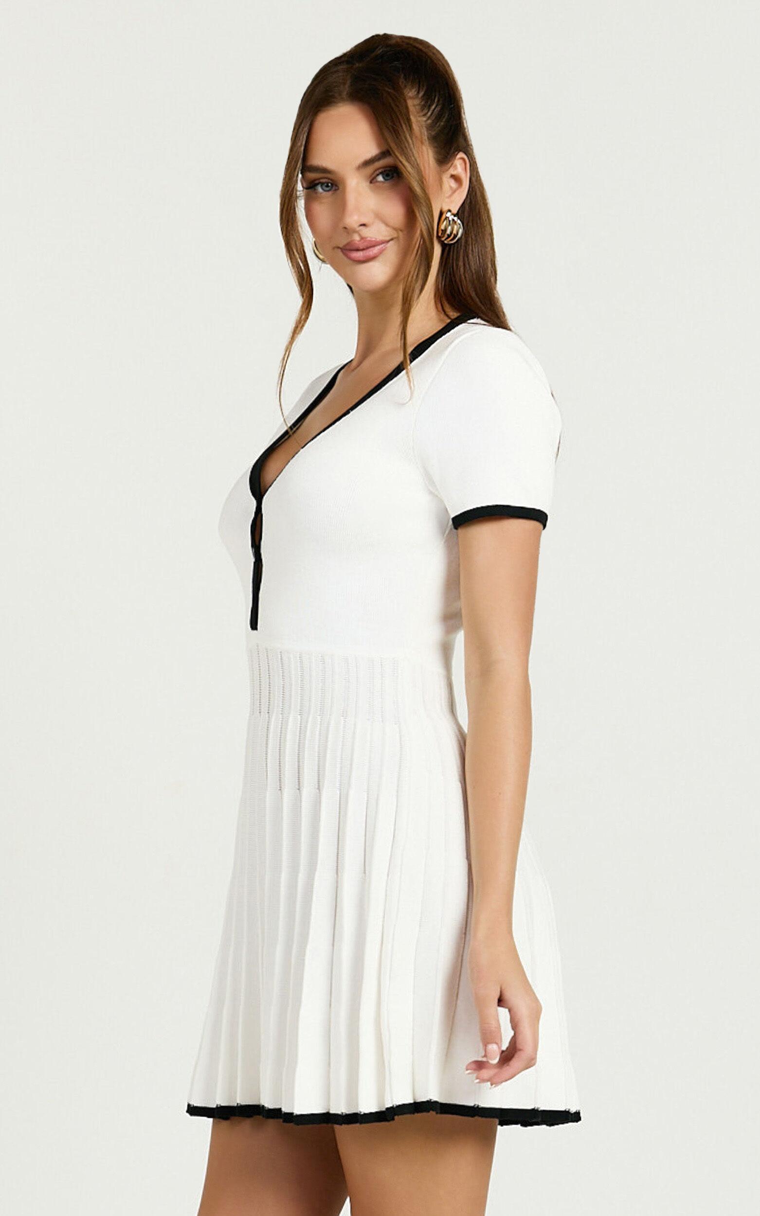 Vivienne Mini Dress - Short Sleeve Pleated Skirt Knitted Dress in Cream Product Image