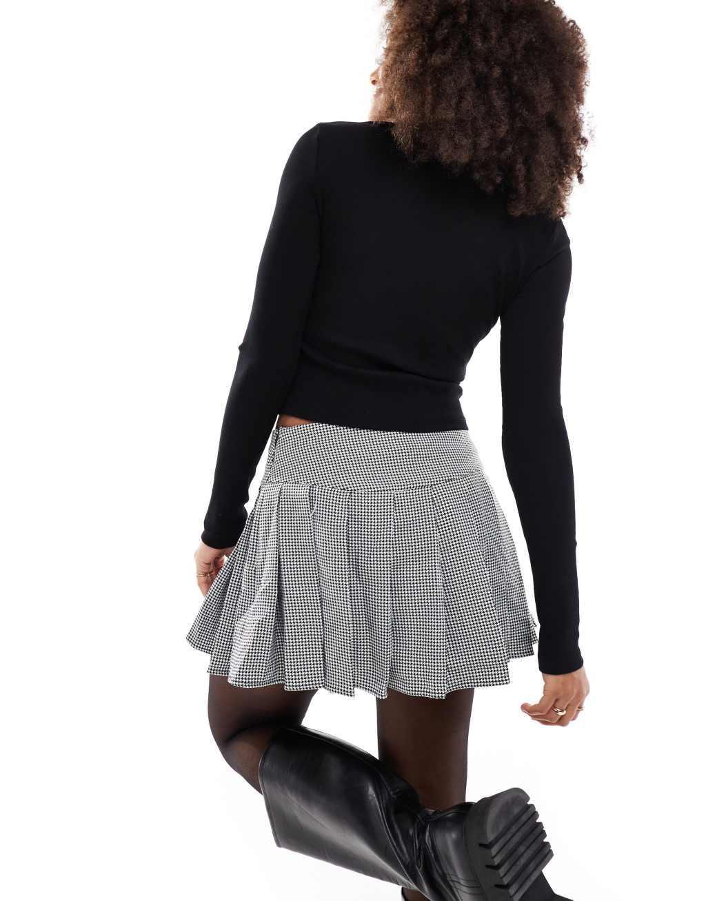 ASOS DESIGN pleated mini skirt in black & white plaid Product Image