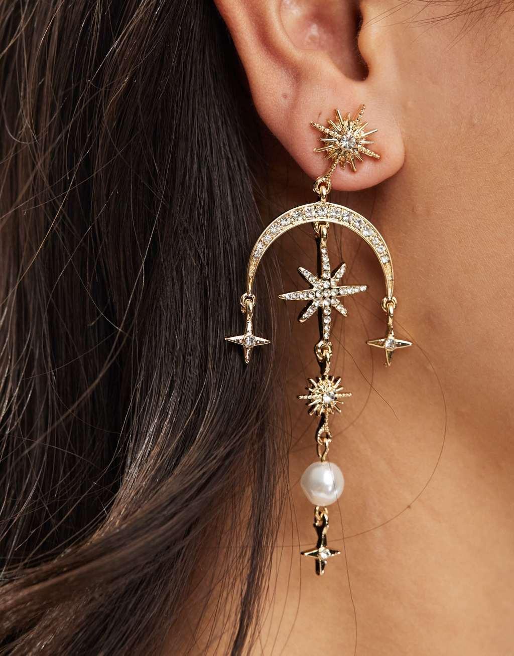 ASOS DESIGN drop earrings with celestial crystal and faux pearl detail in gold tone Product Image