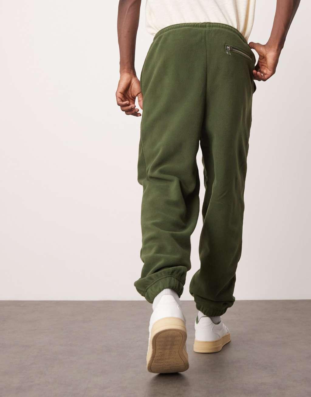 ASOS DESIGN oversized fleece sweatpants in green Product Image