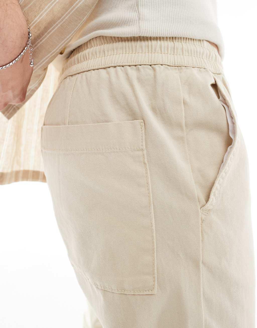 ASOS DESIGN slim pull on pants in beige Product Image