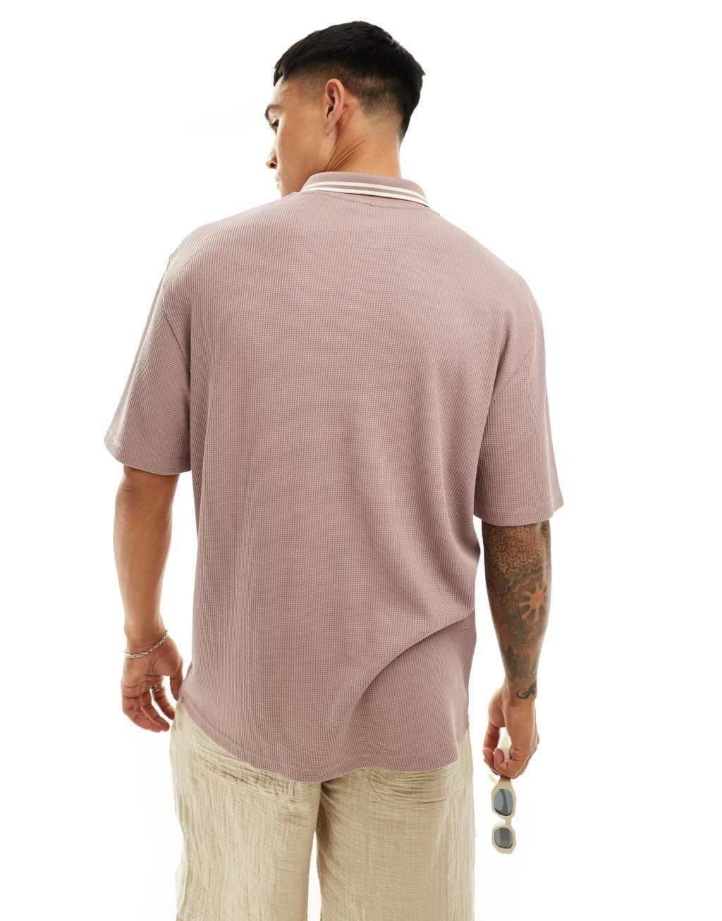 ASOS DESIGN relaxed button-up polo shirt in pink Product Image