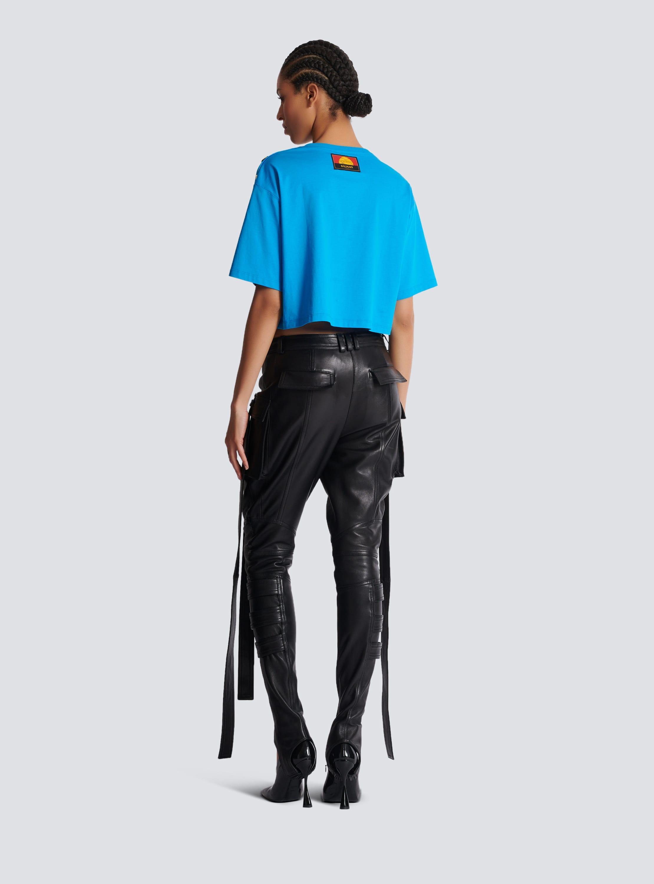 Leather cargo trousers with straps Product Image