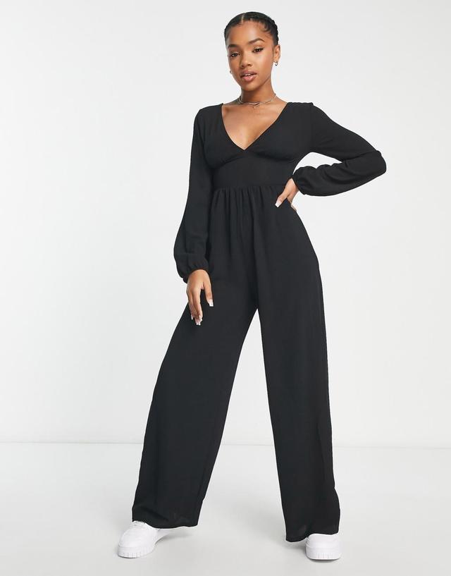 ASOS DESIGN bubble crepe button back long sleeve jumpsuit in black Product Image