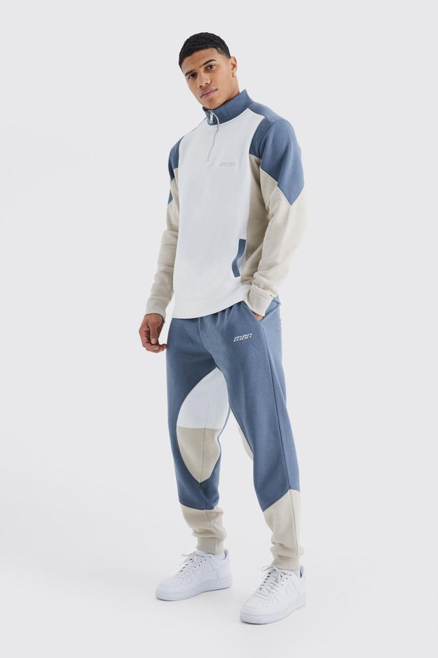 Man 1/4 Zip Funnel Neck Colour Block Tracksuit | boohooMAN USA Product Image