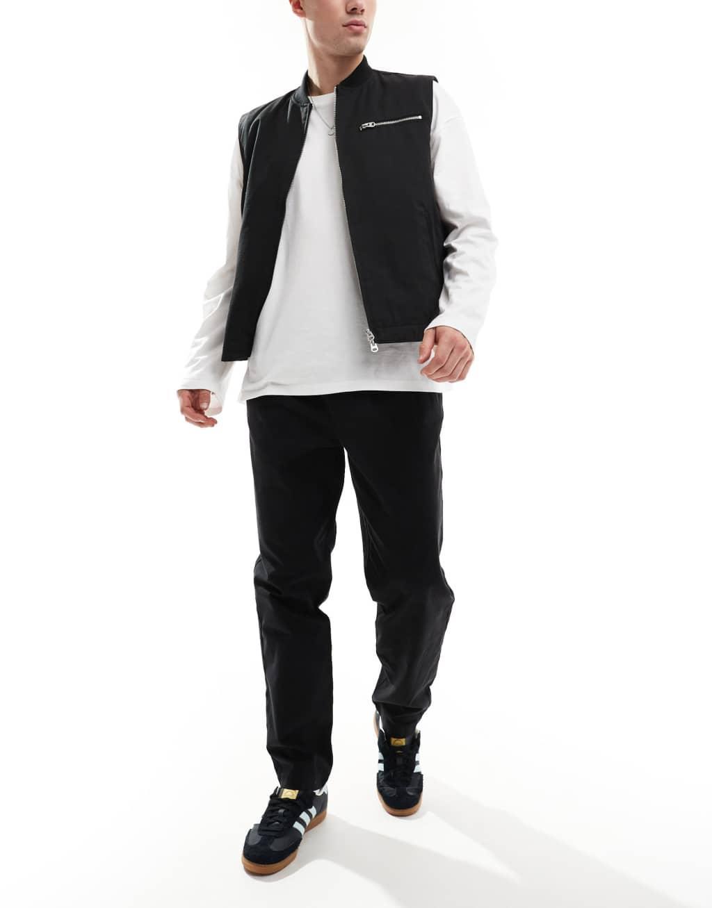 ASOS DESIGN tapered pull on pants with back pocket patch in black Product Image