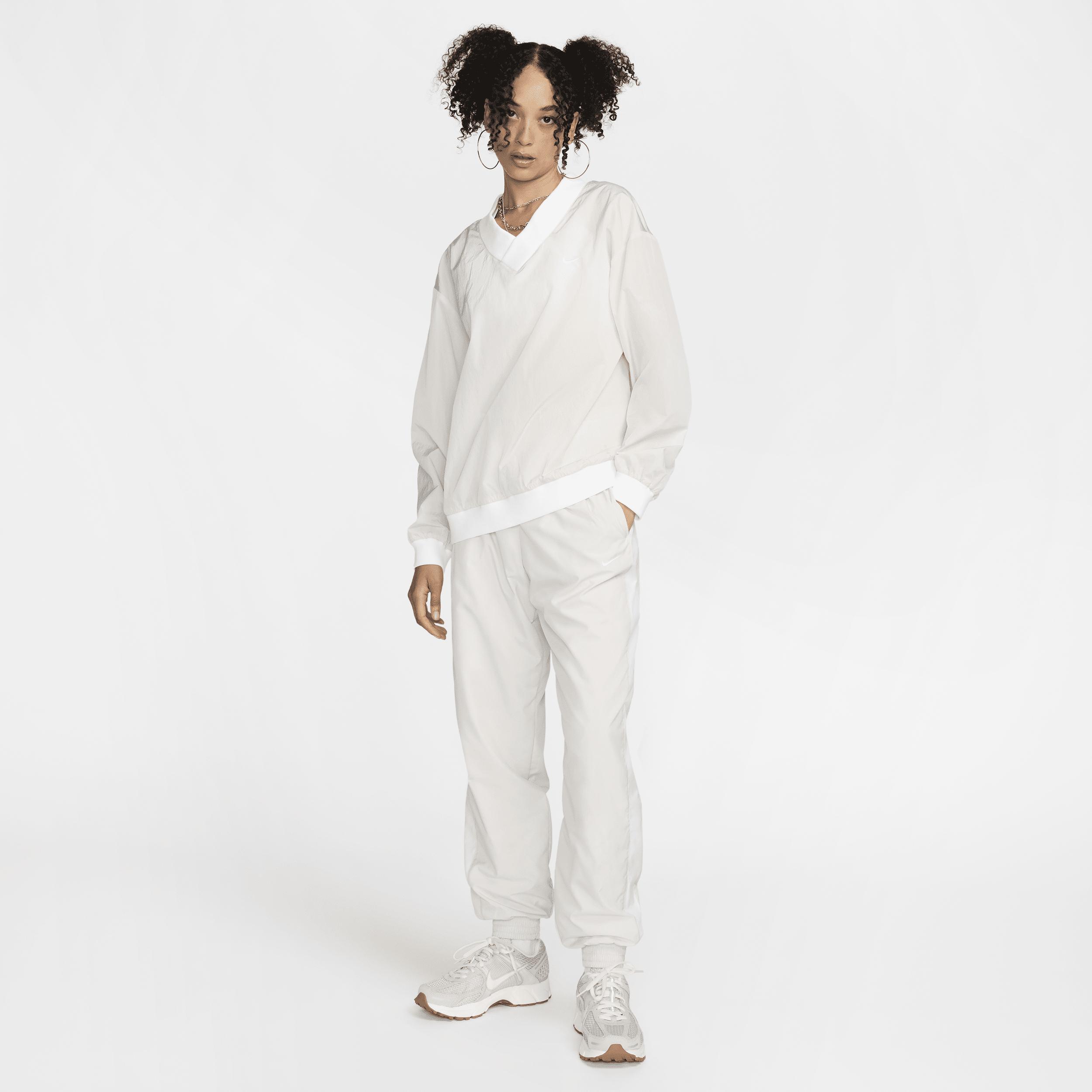 Women's Nike Sportswear Essential Loose UV Woven Long-Sleeve V-Neck Top Product Image