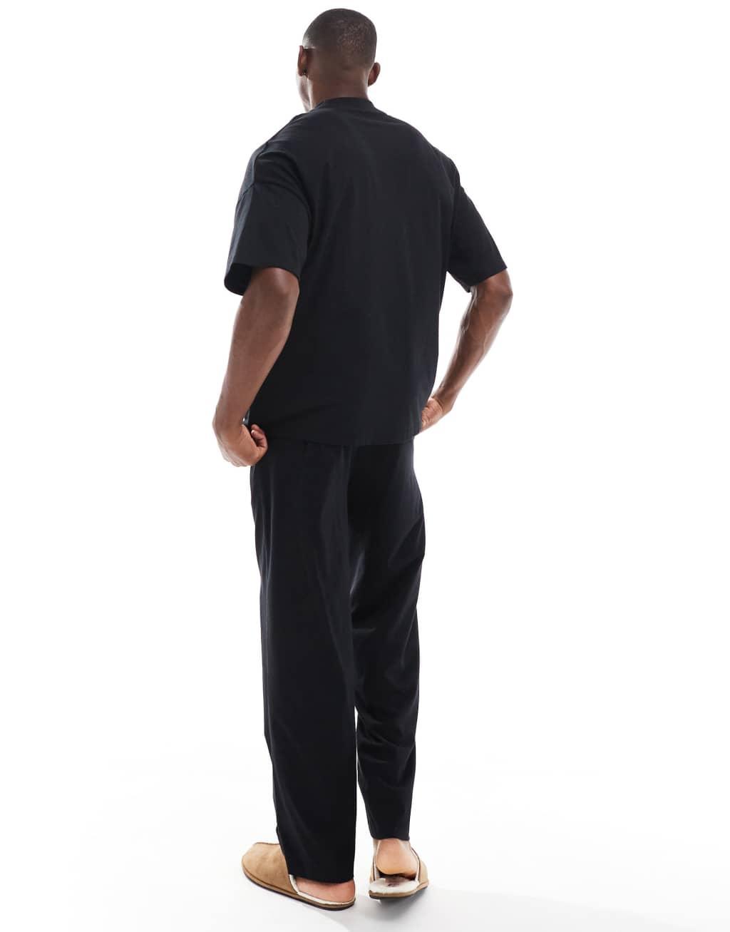 ASOS DESIGN jersey pajama set with oversized t-shirt and pants in black Product Image