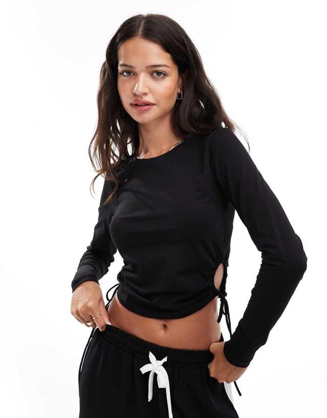 Pieces ruched tie side jersey top in black Product Image