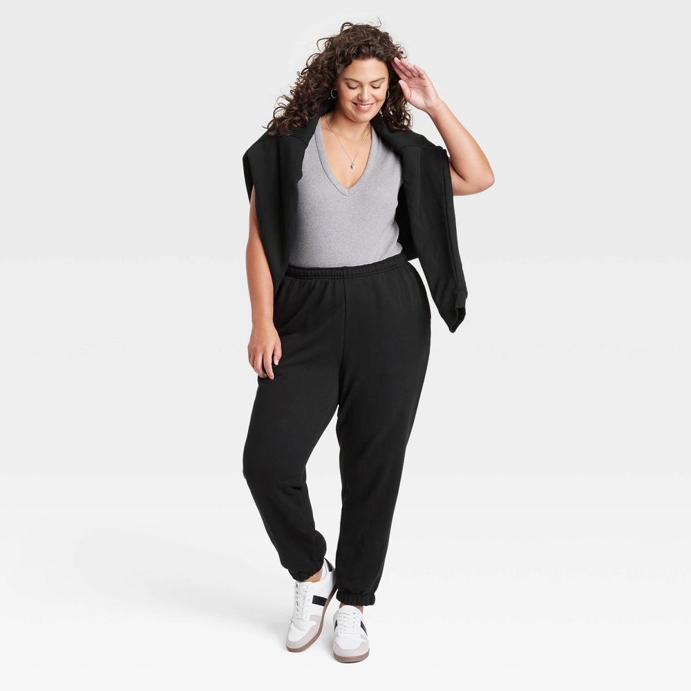 Women's Leisure Studio Mid-Rise Essential Joggers - Universal Thread™ Black 1X Product Image