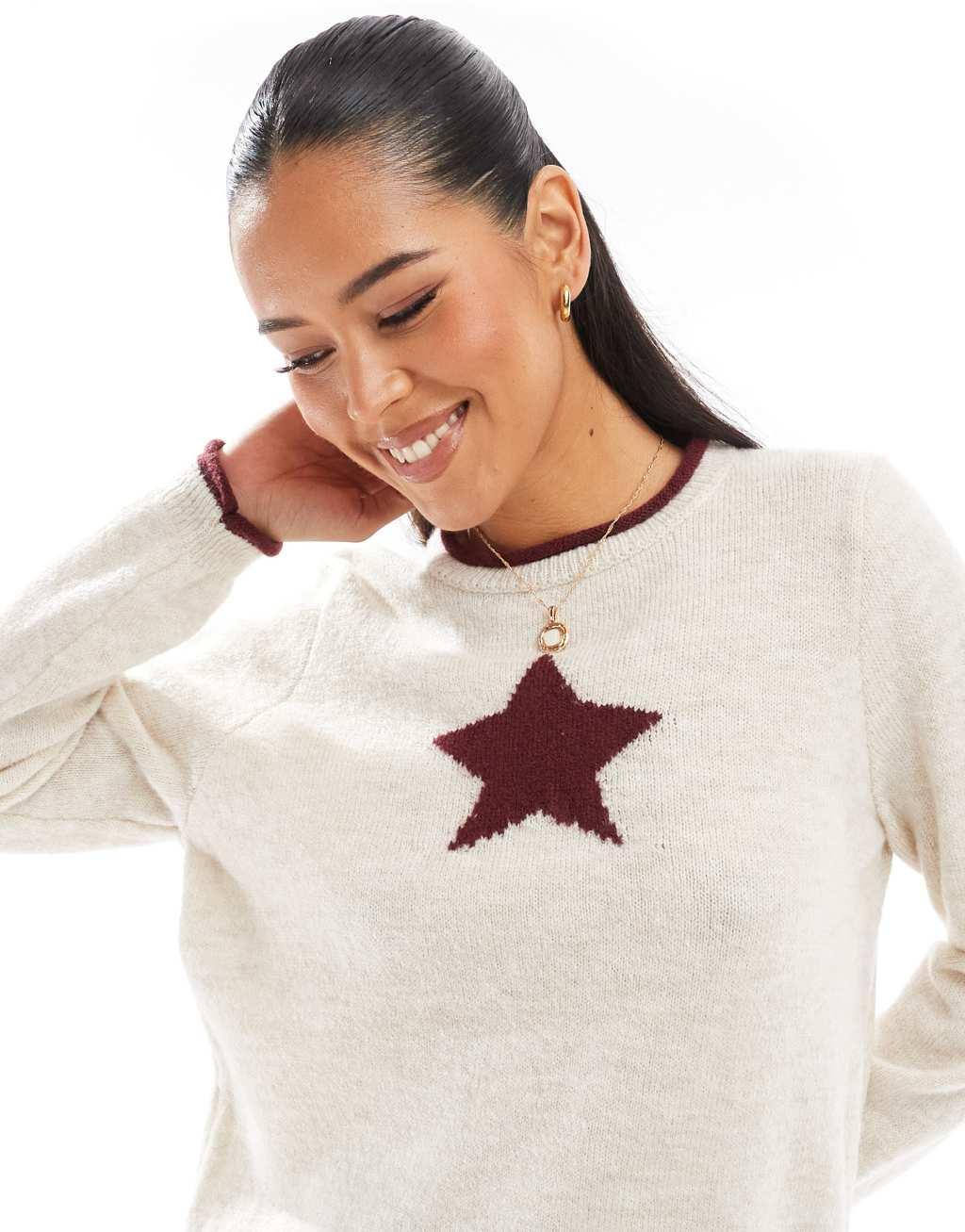 ASOS DESIGN oversized sweater with star graphic in cream and red Product Image