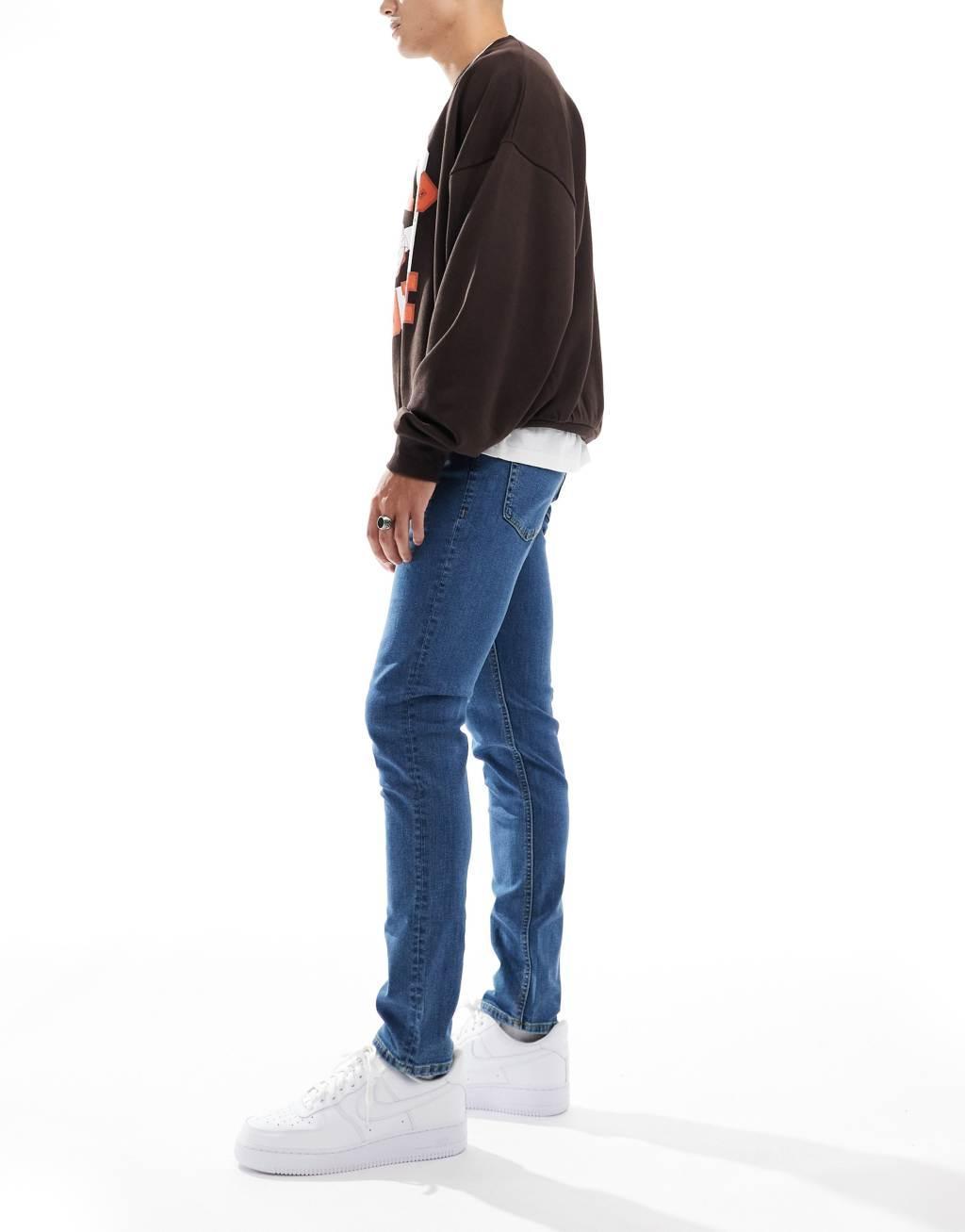 JJ Rebel luke slim fit jeans in mid blue wash  Product Image