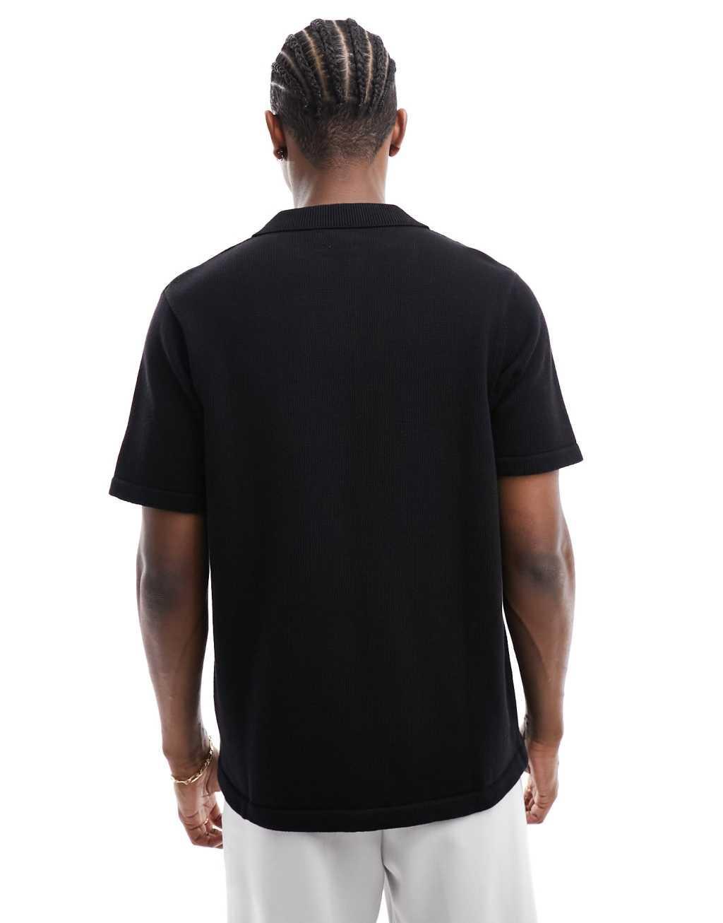 ASOS DESIGN midweight knitted cotton button through polo in black Product Image