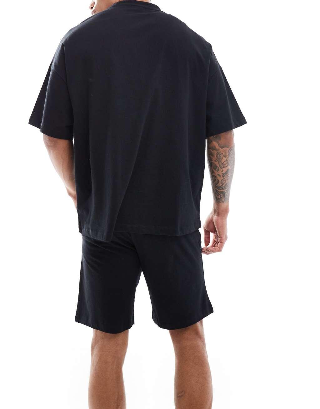 ASOS DESIGN pajama set with oversized t-shirt and shorts in jersey in black  Product Image