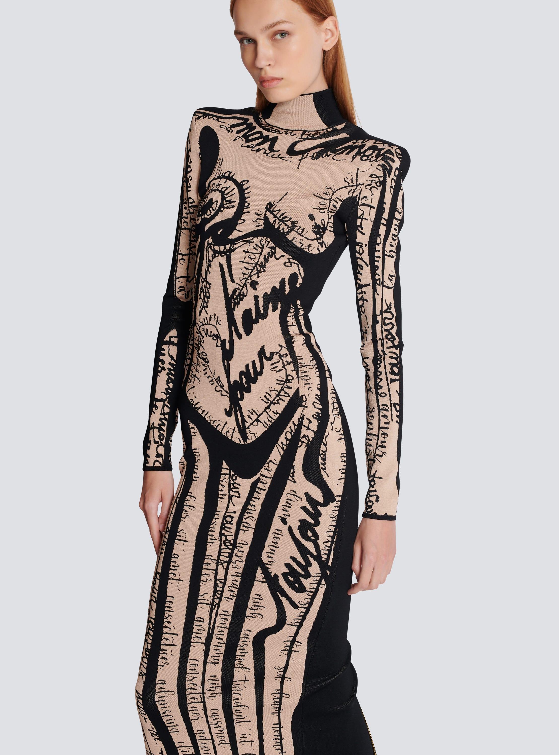 Long knit dress with body motif Product Image