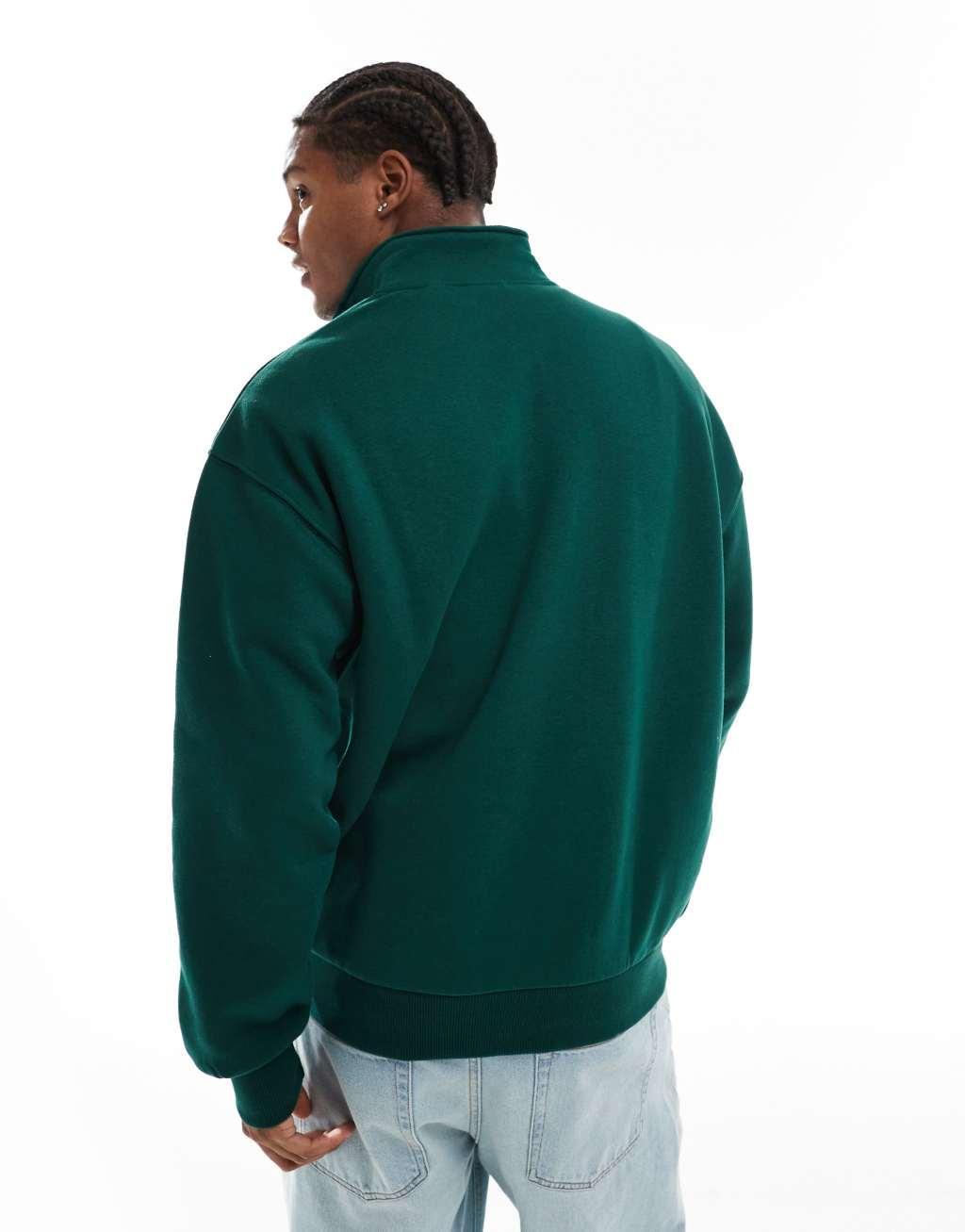 Bershka 1/4 zip printed sweatshirt in green Product Image