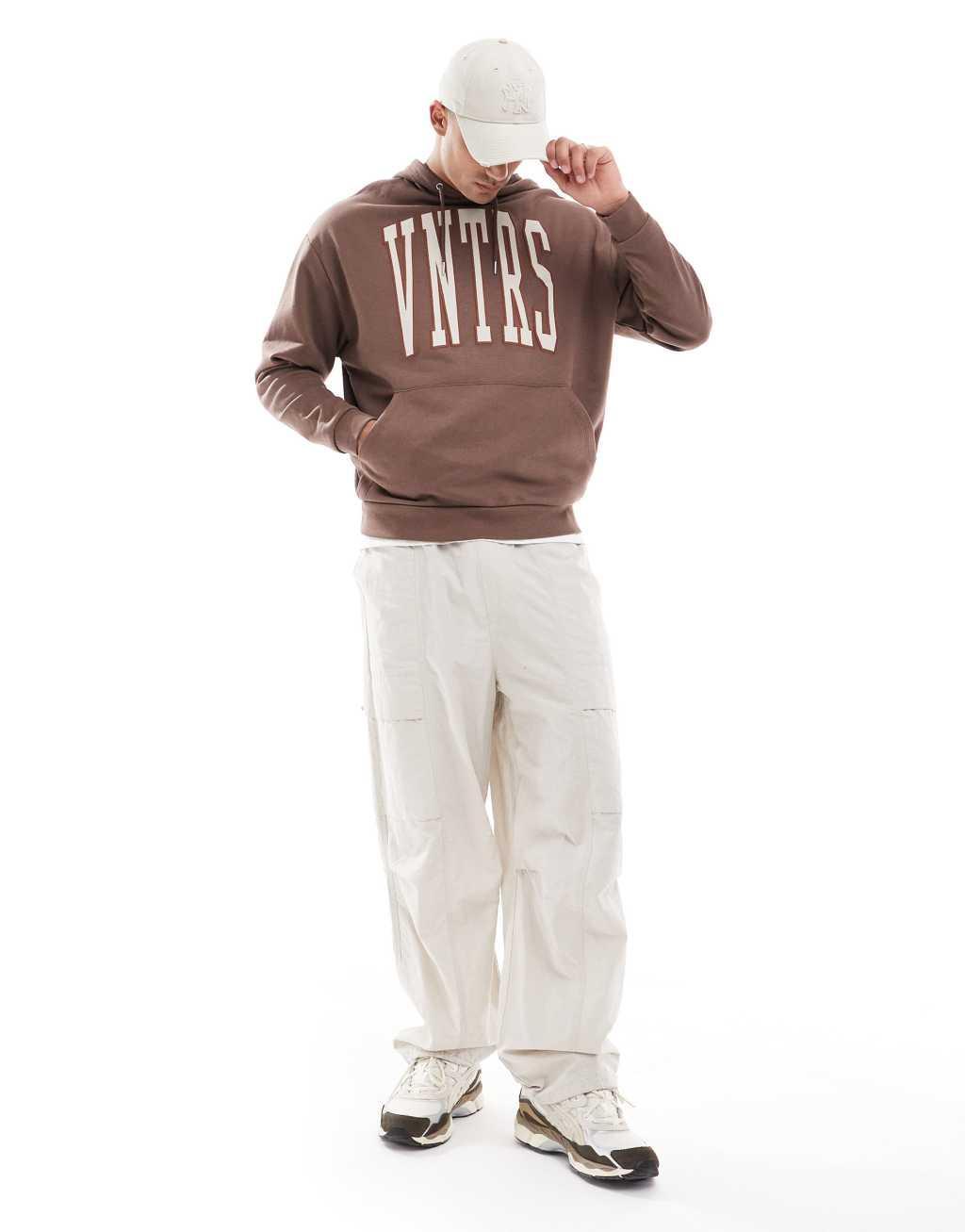 ASOS DESIGN oversized sweatshirt with chest applique in brown Product Image