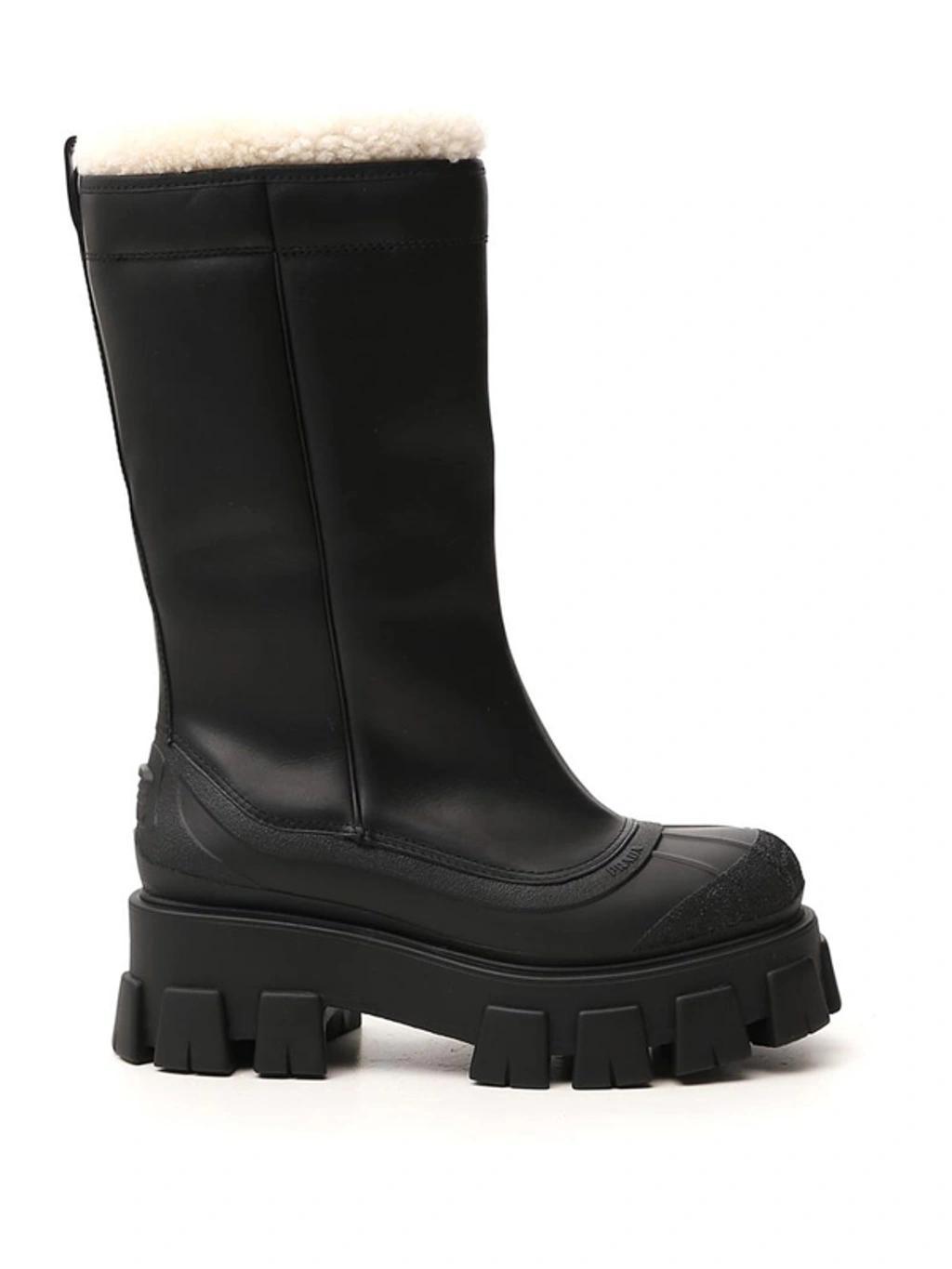 Monolith Shearling-lined Leather Boots In Black Product Image