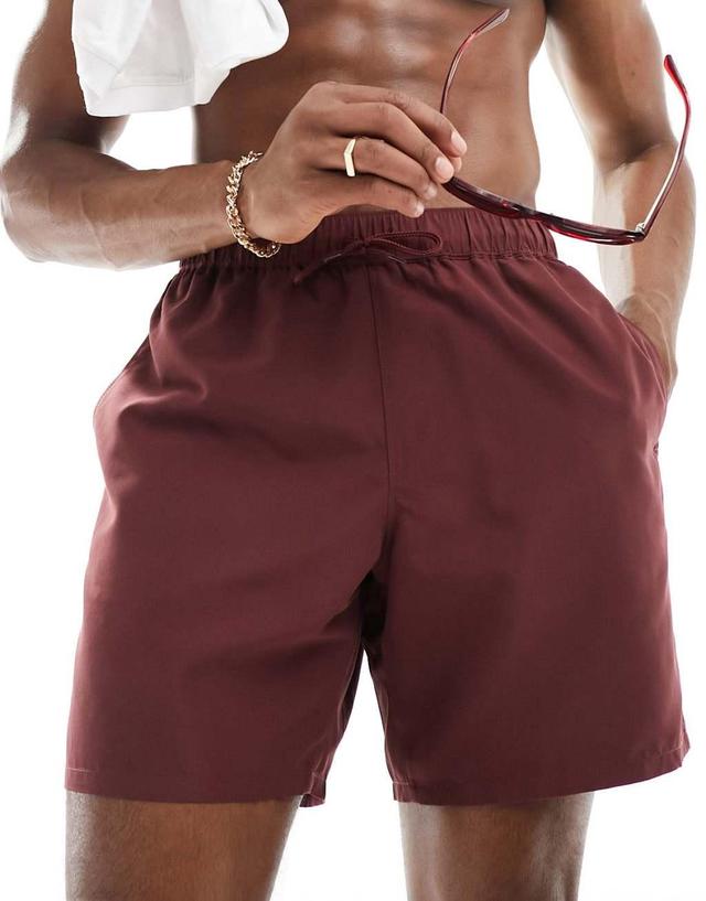 ASOS DESIGN swim shorts in mid length in burgundy Product Image