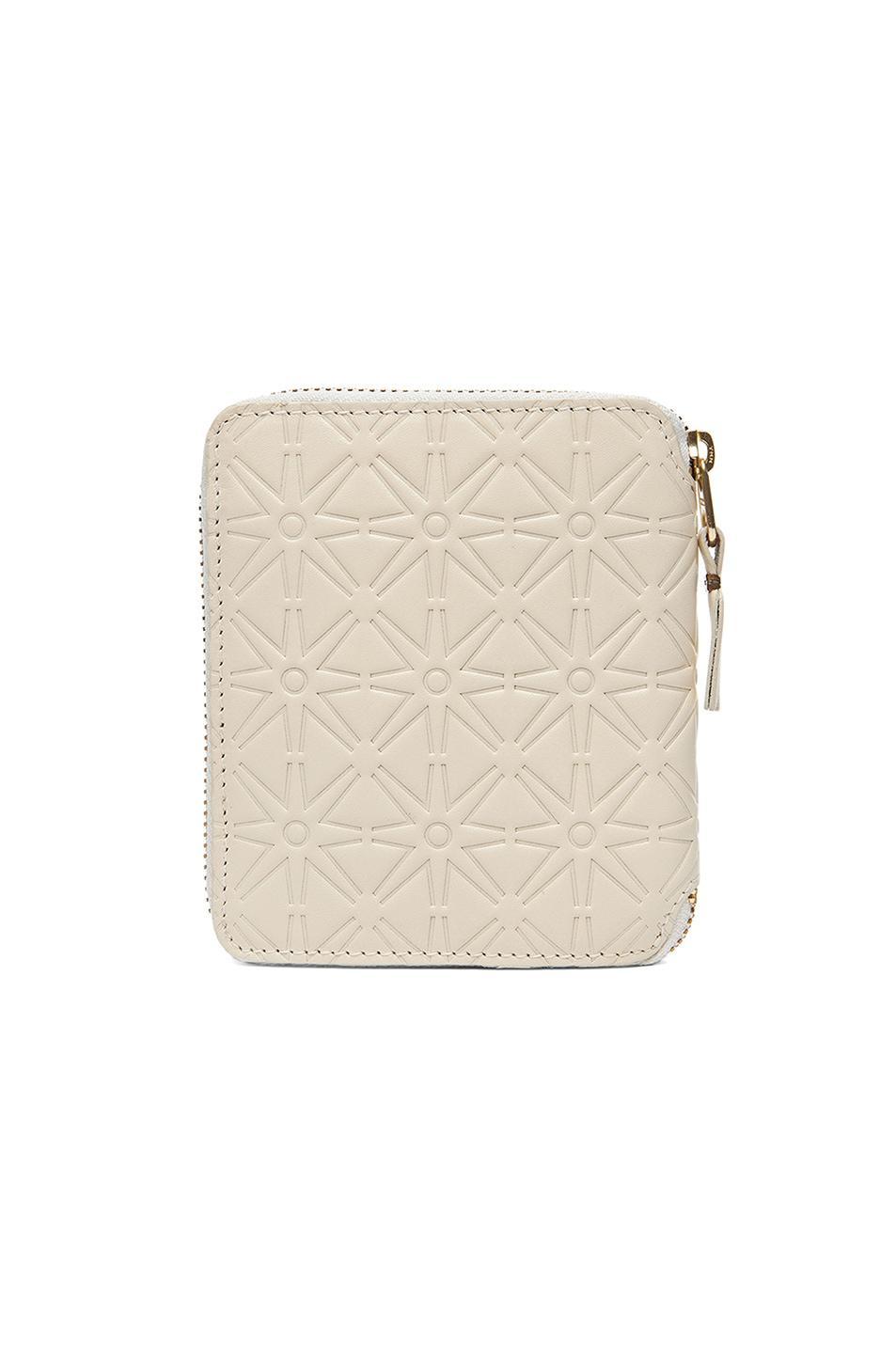 COMME des GARCONS Star Embossed Zip Fold Wallet in White Product Image