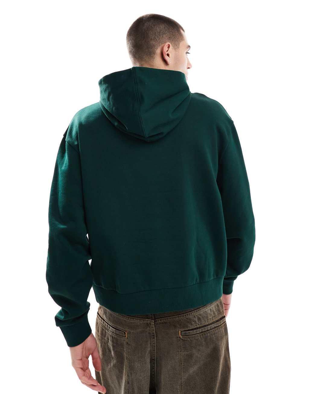 ASOS DESIGN oversized boxy hoodie with belmont print in green Product Image