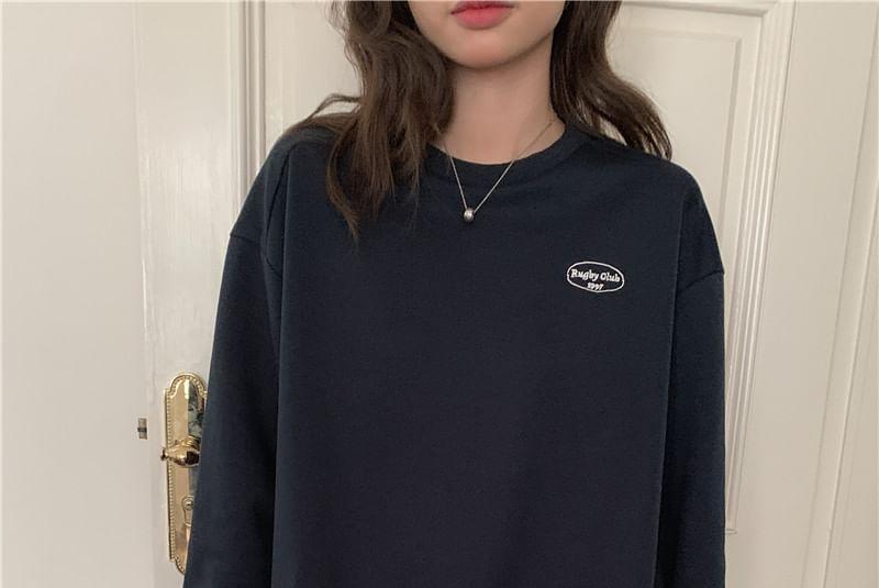 Set: Crewneck Lettering Sweatshirt + Mini Pleated Skirt Product Image