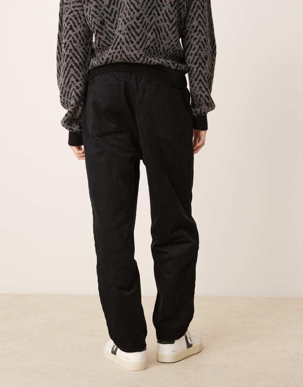 ASOS DESIGN tapered pull on corduroy sweatpants in black  Product Image