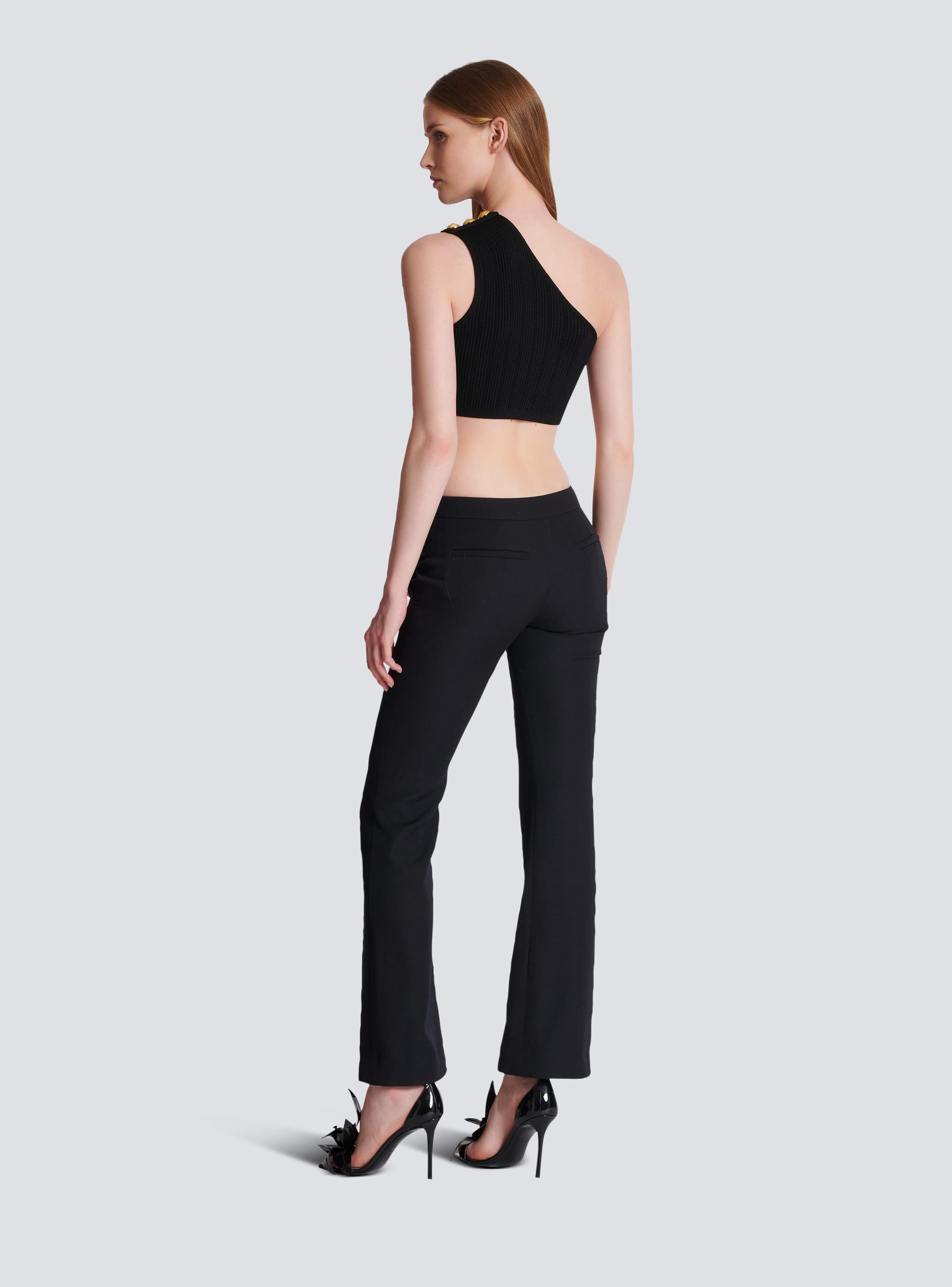 Flared trousers with buttons Product Image