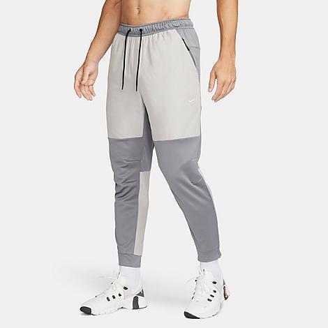 Nike Mens Unlimited Water-Repellent Tapered Versatile Pants Product Image