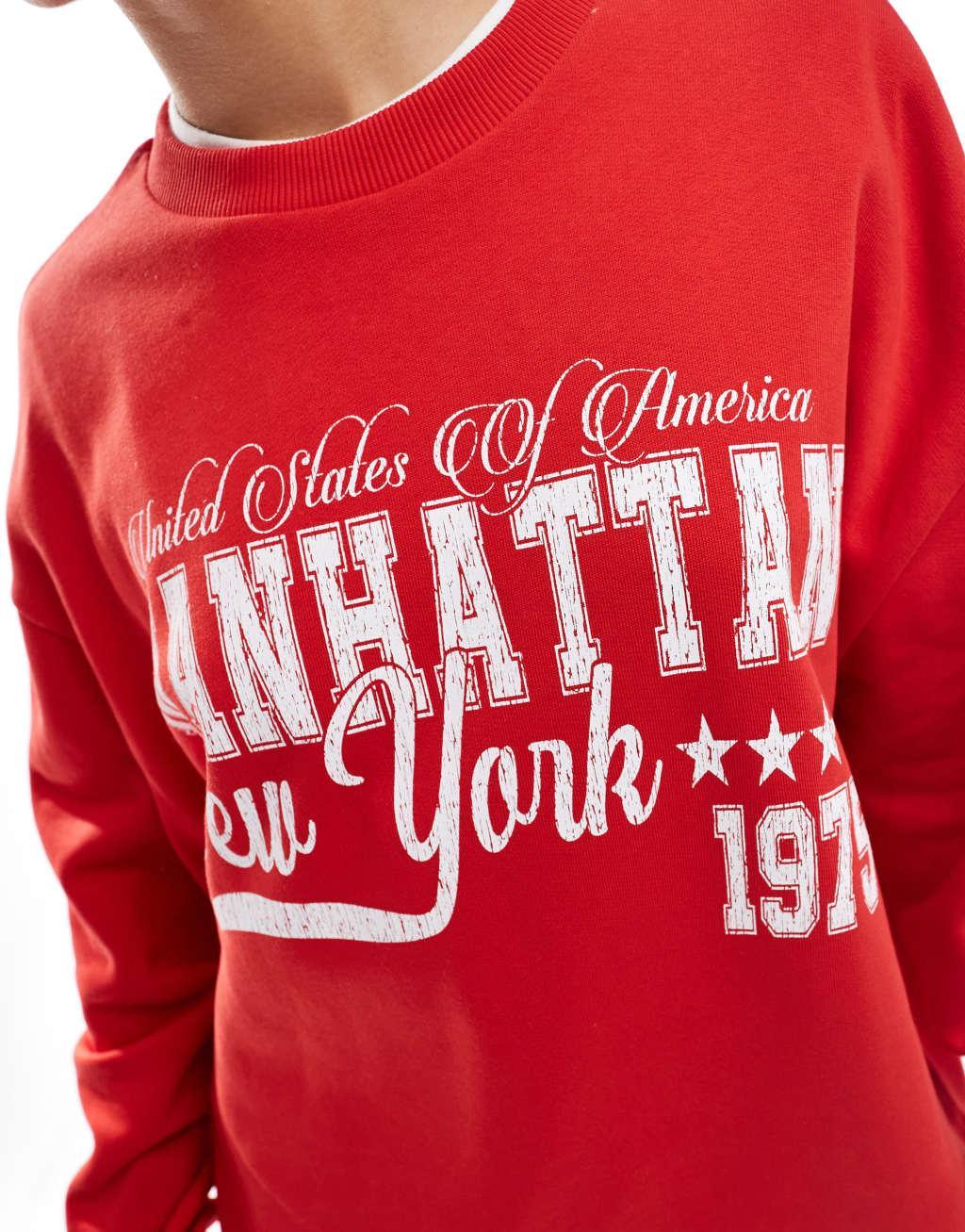 ASOS DESIGN oversized sweatshirt with Manhattan graphic in red Product Image