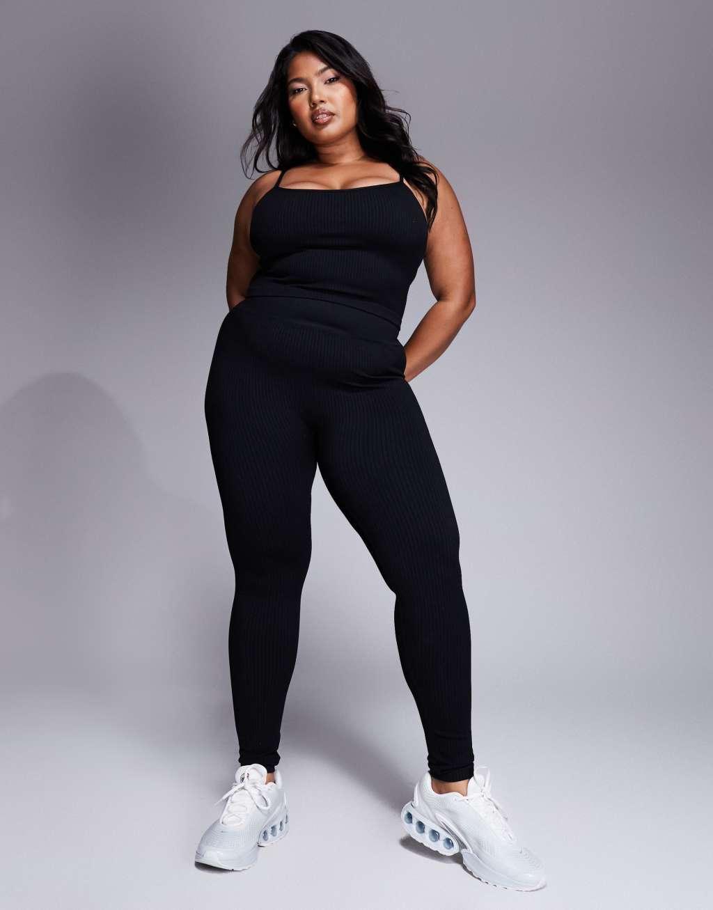 ASOS 4505 Icon Curve seamless ribbed yoga tank top with inner bra in black Product Image