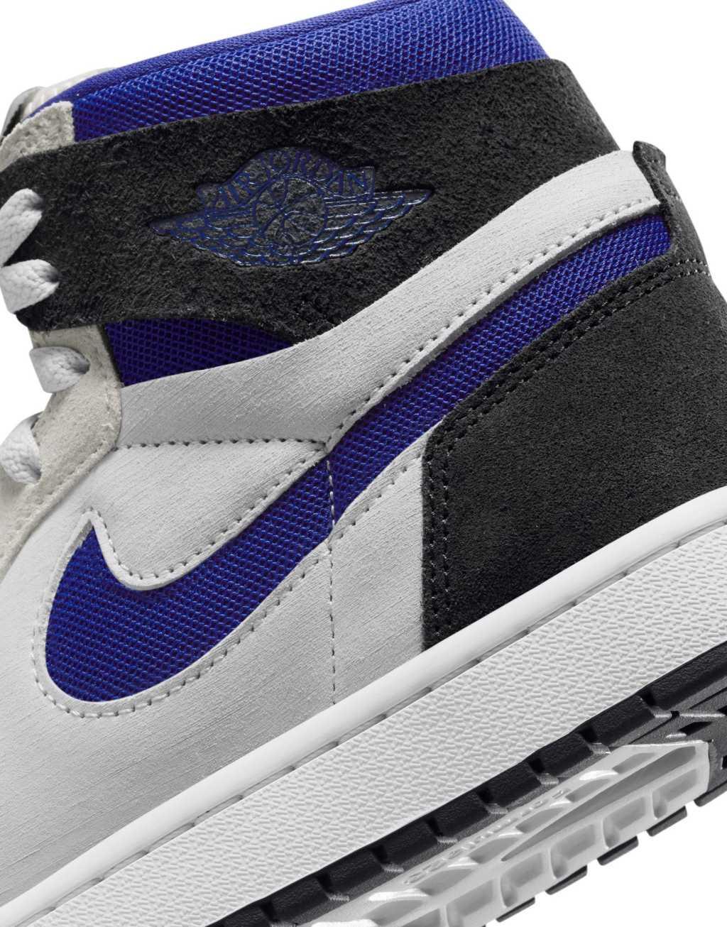 Nike Air Jordan 1 Zoom Comfort 2 sneakers in white, black, and blue Product Image