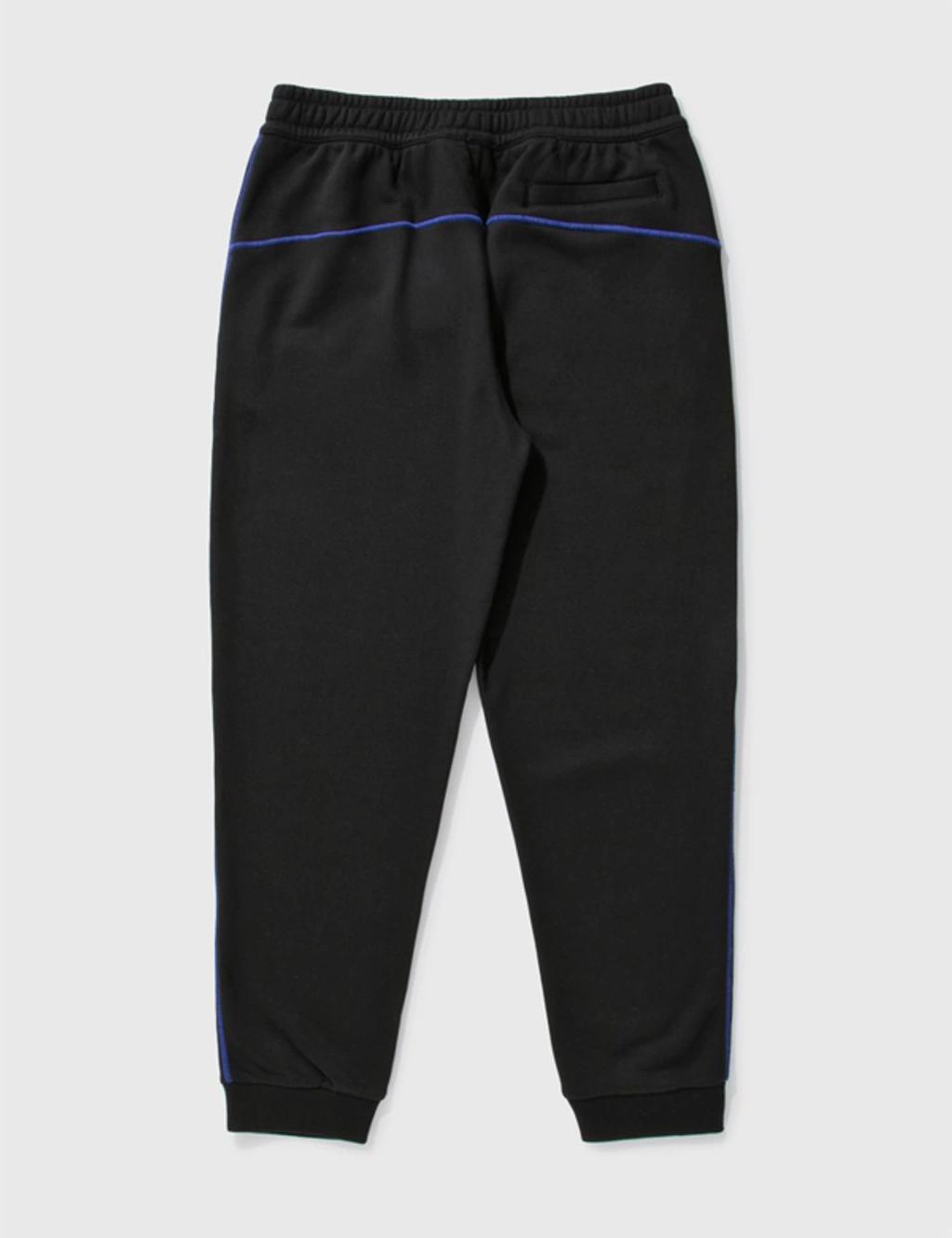 BURBERRY Logo Graphic Appliqué Cotton Jogging Pants In Black Product Image