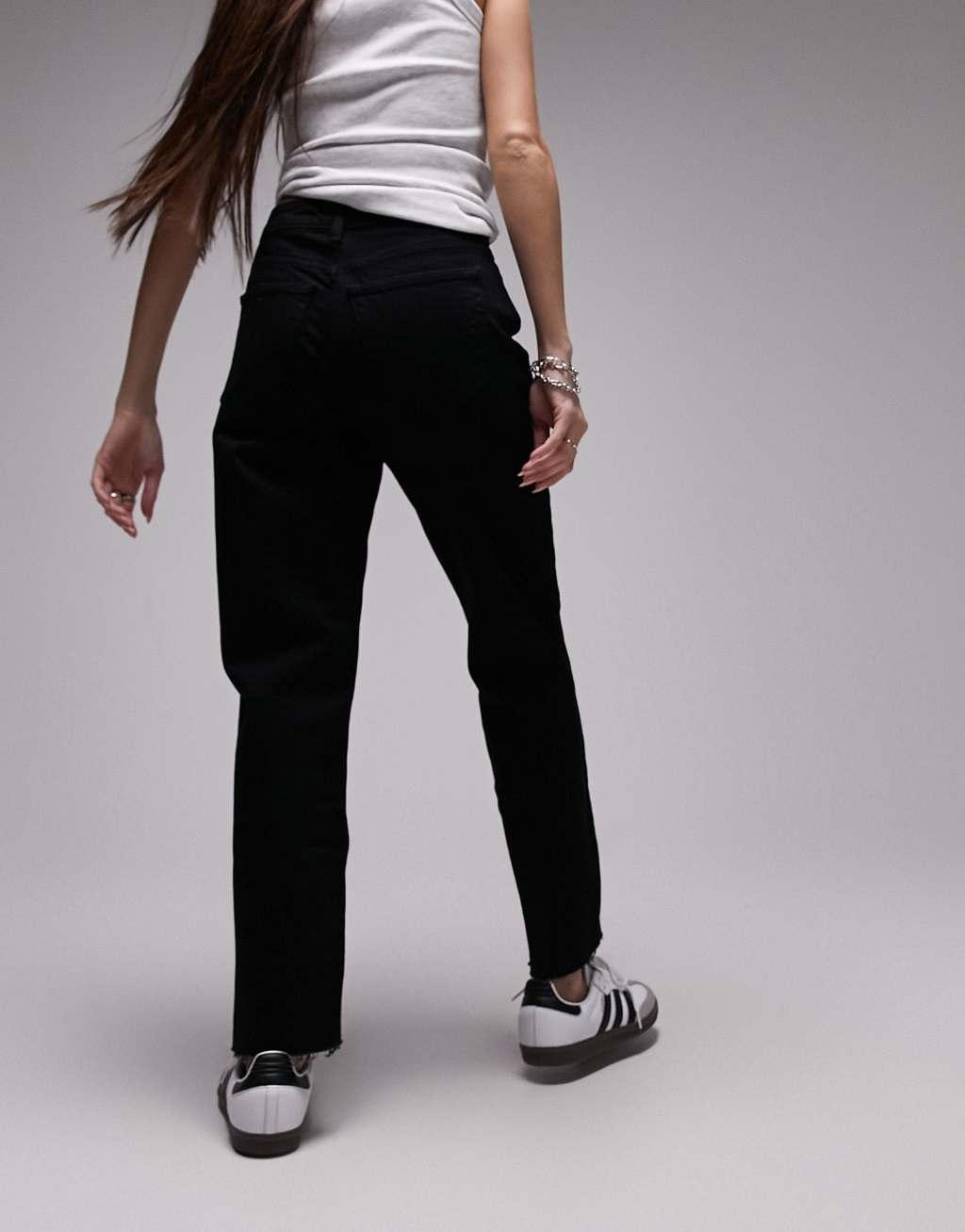 Topshop cropped mid rise straight jeans with raw hems in black Product Image