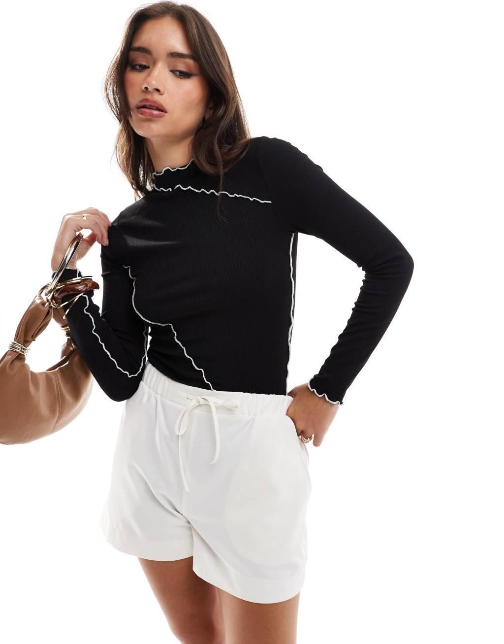 Pieces long sleeve top with contrast lettuce edge detail in black Product Image