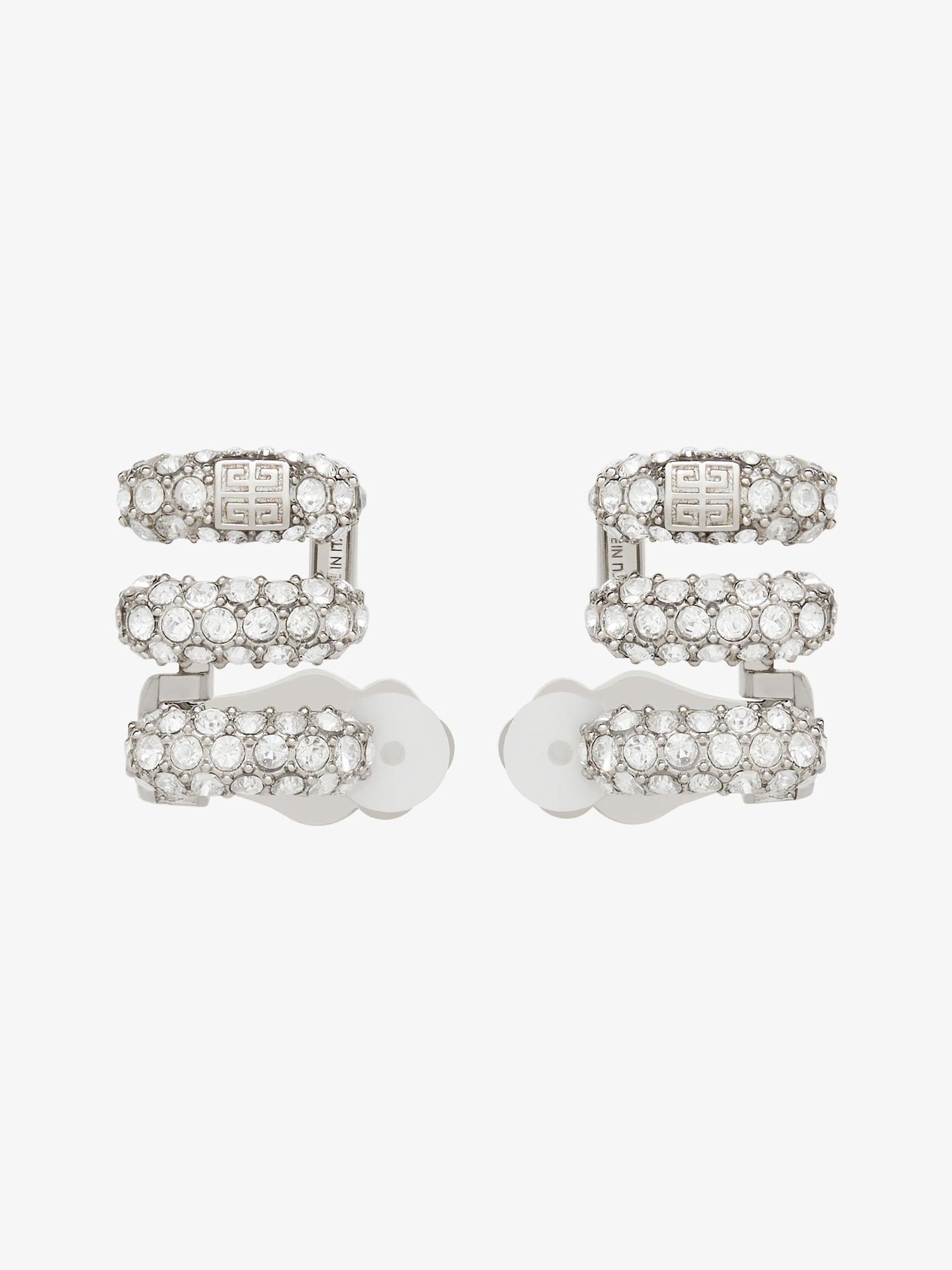 Stitch clip earrings in metal with crystals Product Image