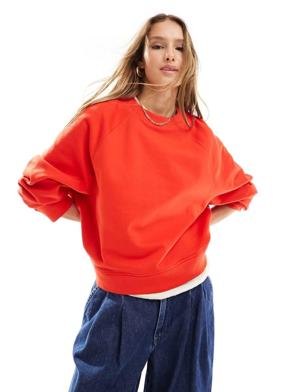 ASOS DESIGN oversized sweatshirt with raglan detail in red Product Image