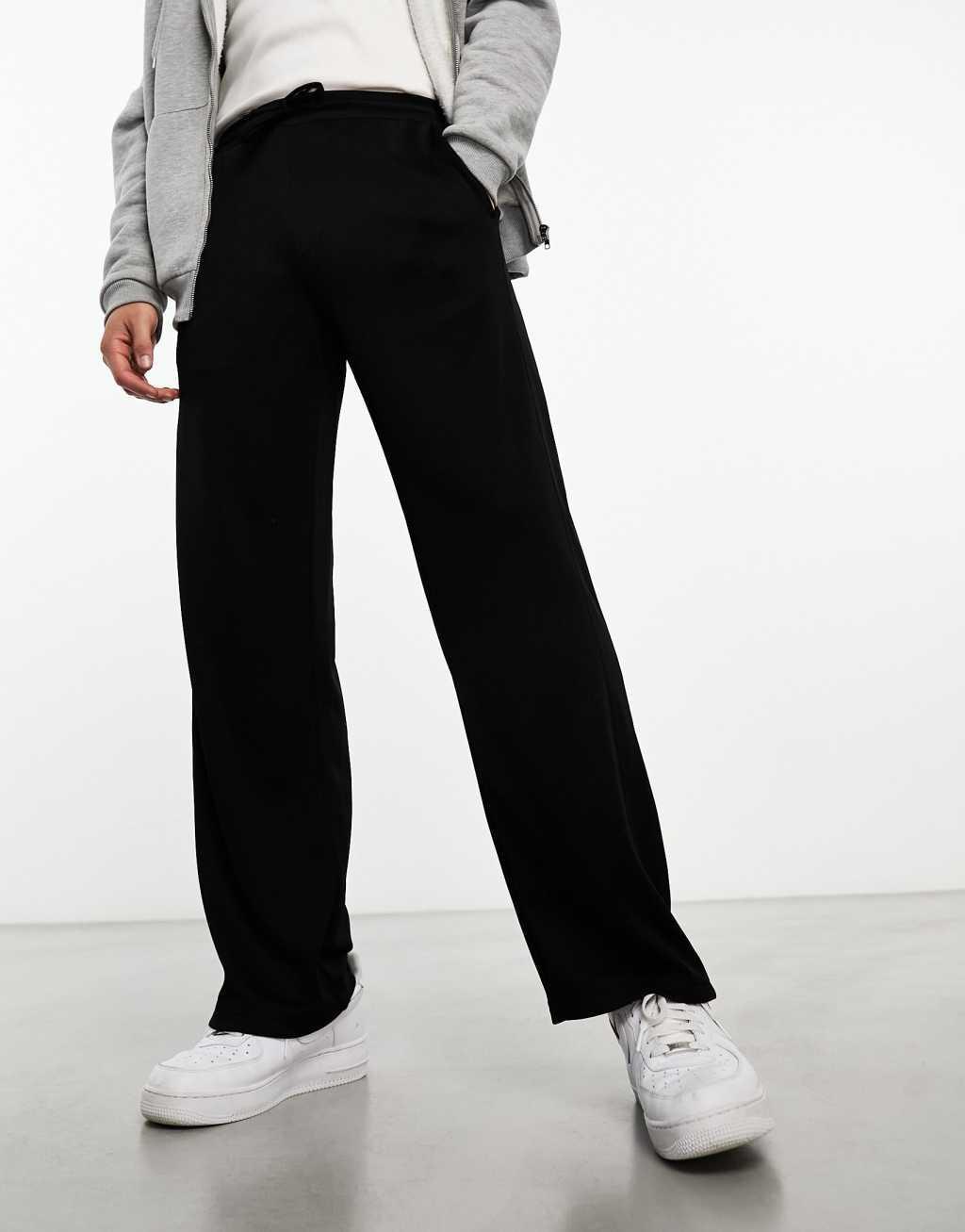 Weekday Hank tracksuit pants in black Product Image