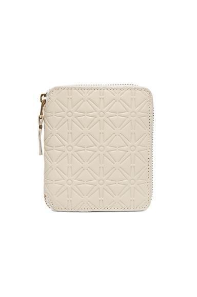 COMME des GARCONS Star Embossed Zip Fold Wallet in White Product Image