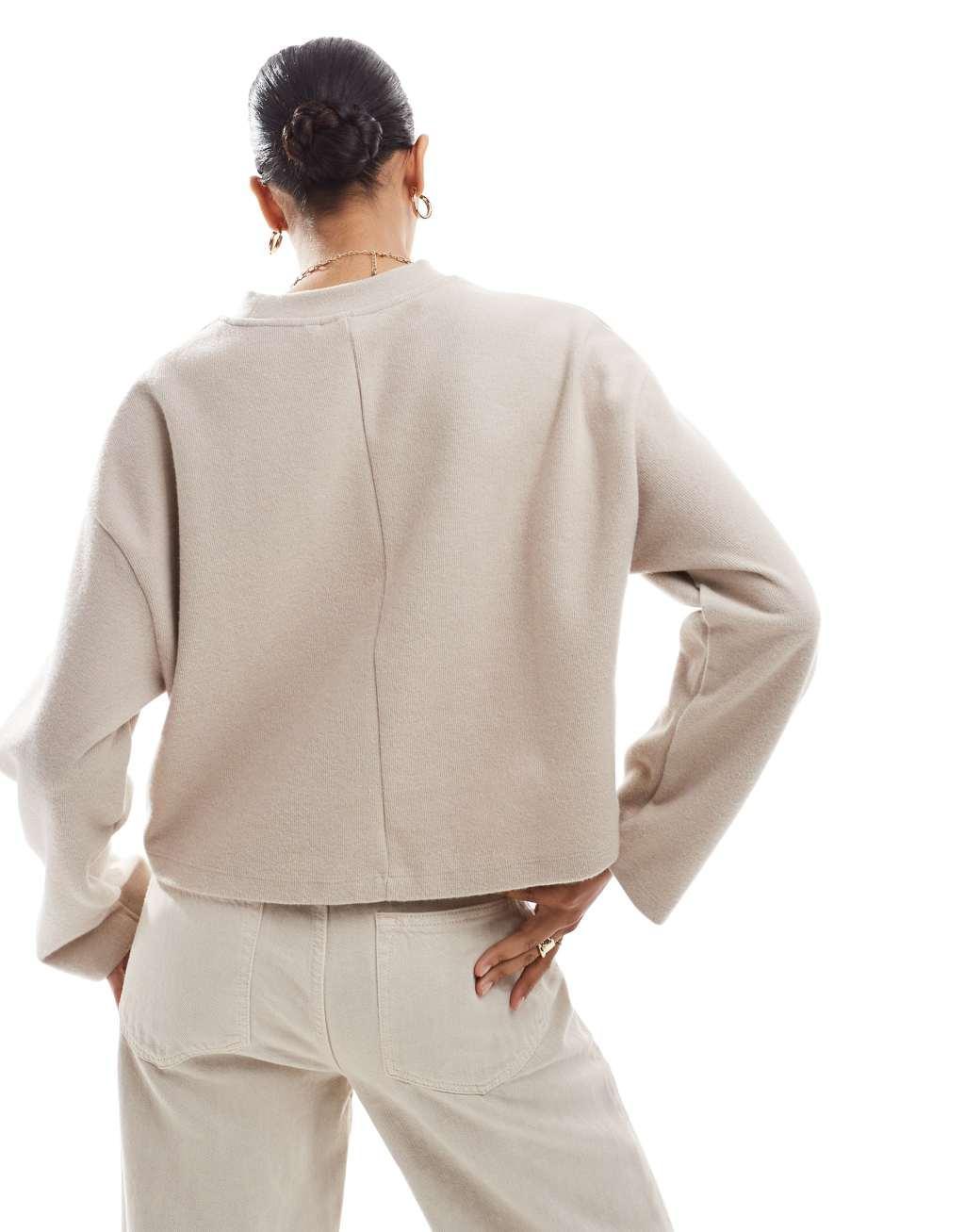 ASOS DESIGN supersoft oversized sweater with pocket detail in warm cream Product Image