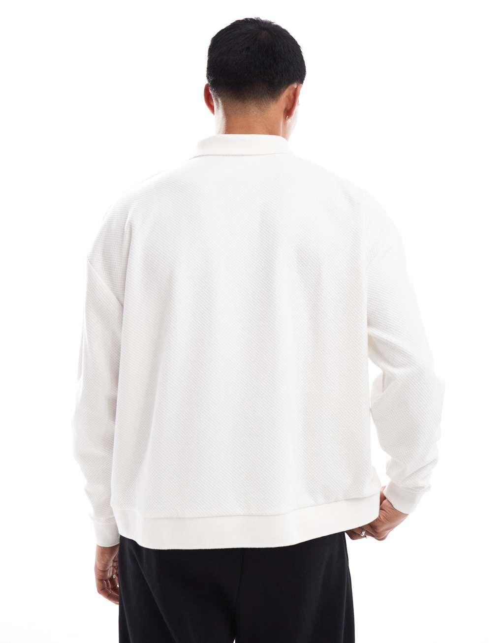 ASOS DESIGN oversized boxy long sleeve polo with flat knit cuff and hem in cream Product Image