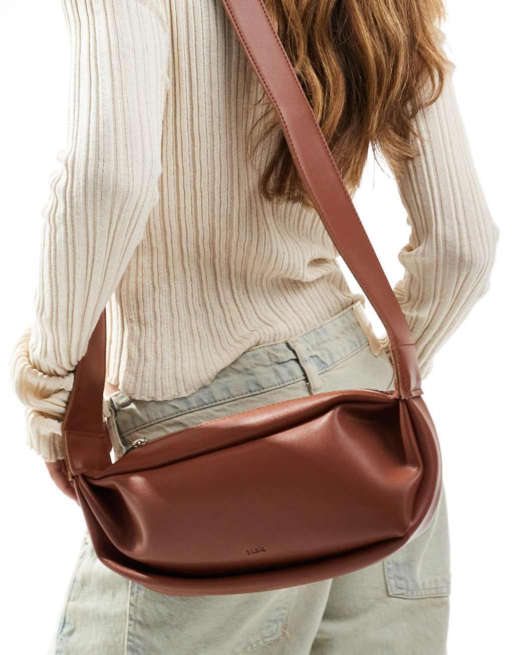 PASQ scoop crossbody sling bag in brown  Product Image